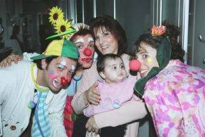 A group of Italian clowns with Holly at a hospital