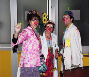 Three clowns in a hospital in Tuscany, Italy