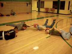 Clown students lie on the floor