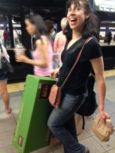 Holly travels with a lunch and box on the subway