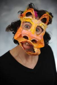 Holly Adams wears a brightly colored mask