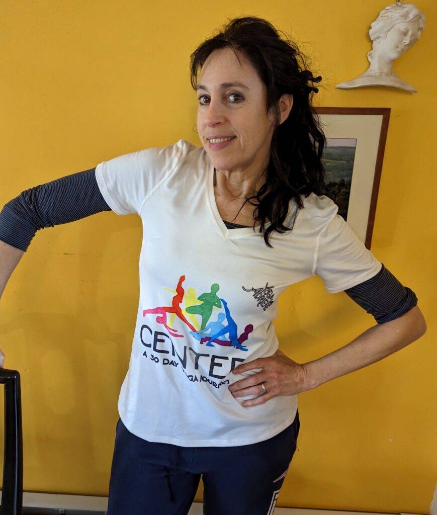 Holly wears her shirt from Center 30-day Yoga with Adriene challenge