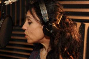 Holly narrates in her home studio
